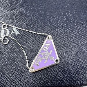 AUTHENTIC Prada charm on sterling silver chain. Purple.